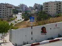 Naji el-Ali and Handala graffiti on a Ramallah wall by Palestinian street artist