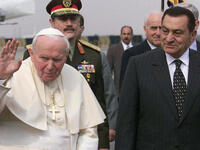Pope John Paul II poses with then President Mubarak on his Egypt tour