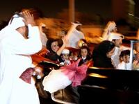 Sheikha Moza bint Nasser al-Missned (car L), wife of Qatari Emir Sheikh Hamad bin Khalifa al-Thani, waves to the crowds as she arrives with her grandchildren to Doha coming from Zurich.