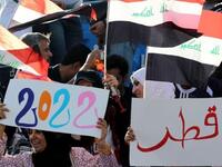 Iraqi football fans show their support to Qatar's bid to host the 2022 World Cup as they attend the 20th Gulf Cup semi-final football match between Iraq and Kuwait in the southern Yemeni city of Aden. Kuwait won on penalty shots after a 2-2 draw.