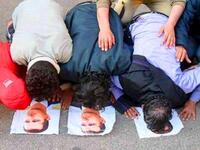 More Mosque Massacres: Reports are rife of worshipers under attack as they 
left their mosques. One witness, Hamawi, said buses packed with soldiers and police surrounded every mosque in Hama. Crowds chanted, "We will not kneel."- implying their supplication was to God alone, and that Syria's regime could no longer rule them by force.
