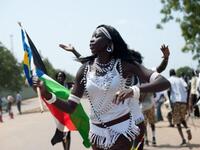 Women from a cultural dance troupe parade through Juba.