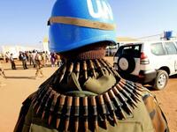 UN peace keepers secure the area as Qatari Minister of State for Foreign Affairs Ahmed bin Abdullah al-Mahmud arrives in Darfur.