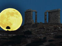 Supermoon next to ruins in Greece.