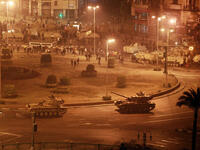 Army tanks line up in Tahrir Square.