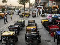 An Iraqi street lined with power generators