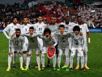 UAE's Al-Jazeera starting eleven pose for a team photo prior to the start of their AFC Champions League third round qualifying football match against Qatar's Al-Sadd club at the Mohammed Bin Zayed Stadium in Abu Dhabi on February 9, 2016. 
