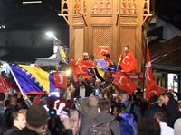 Turkish nationals, supporters of president Recep Tayyip Erdogan, currently residing in Bosnia and Herzegovina, cheer in downtown Sarajevo, late on June 24, 2018. After 15 years in office that have already transformed his country, President Recep Tayyip Erdogan is set to return to power. (STR / AFP)