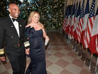 Surgeon General Jerome Adams and his wife Lacey Adams arrive in the “Booksellers Area” of the White House to attend a state dinner honoring France's President Emmanuel Macron on April 24, 2018 in Washington, DC. 
MANDEL NGAN / AFP