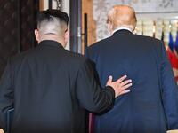 North Korea's leader Kim Jong Un (L) and US President Donald Trump leave following a signing ceremony during their historic US-North Korea summit, at the Capella Hotel on Sentosa island in Singapore on June 12, 2018.  (SAUL LOEB / AFP)