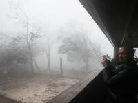 Derik Kline takes shelter in a parking garage as Hurricane Michael passes through the area on October 10, 2018 in Panama City, Florida. (Joe Raedle/Getty Images/AFP )