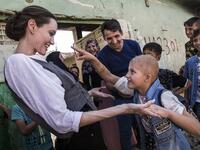Special Envoy Angelina Jolie meeting Falak, 8, during a visit to West Mosul, on June 16, 2018. Falak has a gene disorder and PTSD. (UNHCR/AFP/Andrew McConnell)