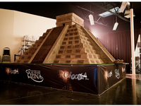 A 18,000 pound chocolate structure – modeled after the Mayan temples.  This required an entire team of builders and pastry experts. (mrkate.com)