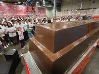 The bar, which stands nearly 3 feet high and measures 21 feet long, weighs 12,290 pound beating the previous record chocolate bar by more than a ton. (amusingplanet.com)