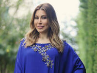 Yara posted a picture in a blue Abaya to send her wishes to her followers during the holy month