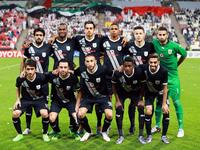 Qatar's Al-Sadd starting eleven pose for a team photo prior to the start of their AFC Champions League third round qualifying football match against UAE's Al-Jazeera club at the Mohammed Bin Zayed Stadium in Abu Dhabi on February 9, 2016. 