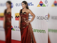 Mona showed up wearing a formal golden bronze dress on Al Gouna Film Festival red carpet 