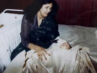 Family album documents Gaddafi children from cradle to grave, in Saifs al-Arab's case:  A special milestone moment, 
mother and newborn, 
celebrating Saif's circumcision ritual-- much like a
Christening. Saif is rumored to have died April 30, 2011, together with some members of the junior Gaddafi tribe, in a 
Nato raid.
