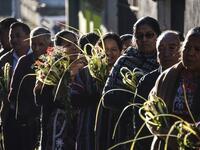 Catholic faithful take part the Palm Sunday procession on April 14, 2019 in San Pedro Sacatepequez, 30 km west of Guatemala City.  Johan ORDONEZ / AFP