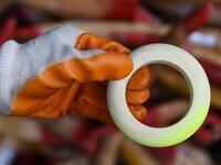 A member of a wildlife personnel team displays a product made from ivory tusks before the confiscated ivory was destroyed at the Kualiti Alam Waste Management centre in Port Dickson on April 30, 2019.  Mohd RASFAN / AFP