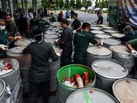 Wildlife personnel open containers of seized ivory tusks before the confiscated ivory was destroyed at the Kualiti Alam Waste Management centre in Port Dickson on April 30, 2019.  Mohd RASFAN / AFP