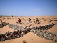 Competitors ride their bikes during Stage 6 of the 14th edition of Titan Desert 2019 mountain biking race between El-Jorf and Erfoud in Morocco on May 3, 2019.  FRANCK FIFE / AFP
