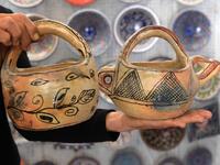 Pottery crafted in Sejnane is displayed at a souvenir shop in the Tunisian capital Tunis. FETHI BELAID / AFP