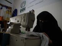 Hasna Dbeis, a 30-year-old former detainee in a Syrian-regime jail, works at a workshop employing former female detainees, in the town of Maarat Nasrin, in the rebel-held part of the Syrian Idlib province  Aaref WATAD / AFP
