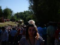 Pilgrims cross the Quema river in Villamanrique, during a pilgrimage to the village of El Rocio.  CRISTINA QUICLER / AFP