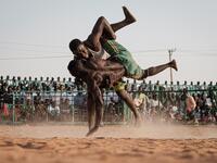 Originating in the Nuba mountains, the sport has become wildly popular country-wide in recent years. The Sudanese Nuba wrestling federation organizes matches every Friday that attract hundreds of people. Yasuyoshi CHIBA / AFP