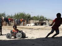 Palestinian children play at an impoverished neighbourhood in Gaza City on July 4, 2019.  MOHAMMED ABED / AFP