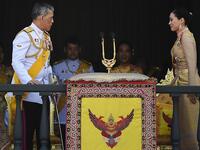 Thailand's King Maha Vajiralongkorn and Queen Suthida appear on the balcony of Suddhaisavarya Prasad Hall of the Grand Palace as they grant a public audience on the final day of his royal coronation in Bangkok on May 6, 2019.  Jewel SAMAD / AFP