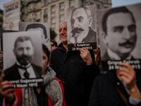 People hold portraits of Armenian intellectuals - who were detained and deported in 1915 - during a rally held to commemorate the 104th anniversary of the 1915 mass killings of Armenians in the Ottoman Empire near Istiklal avenue at Sishane square in Istanbul on April 24, 2019. BULENT KILIC / AFP