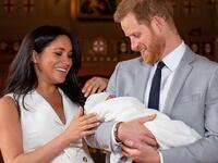 Britain's Prince Harry, Duke of Sussex (R), and his wife Meghan, Duchess of Sussex, pose for a photo with their newborn baby son, Archie Harrison Mountbatten-Windsor, in St George's Hall at Windsor Castle in Windsor, west of London on May 8, 2019.  Dominic Lipinski / POOL / AFP