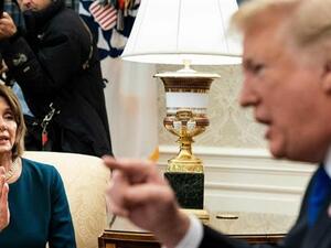 Then-House Minority Leader Nancy Pelosi (L) and US President Donald Trump argue while making statements to the press before a meeting at the White House in Washington, DC, on December 11, 2018. (AFP)