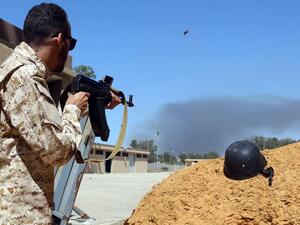 A fighter loyal to the internationally recognised Libyan Government of National Accord (GNA) keeps position near the Salah al-Din military compound, south of the Libyan capital Tripoli, on May 7, 2019. (AFP)