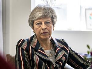 Britain's Prime Minister Theresa May talks with case workers and domestic violence survivors on a visit to a charity providing support for victims of domestic violence in west London on May 13, 2019. (Victoria Jones / POOL / AFP)