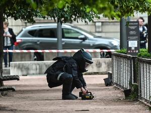 A bomb disposal expert works at the scene of a suspected package bomb blast along a pedestrian street in the heart of Lyon, southeast France, on May 24, 2019. (AFP/ File Photo)