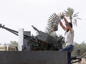 A fighter loyal to the Libyan internationally-recognised Government of National Accord (GNA) loads a heavy machine gun during clashes against forces loyal to strongman Khalifa Haftar. (AFP/ File)