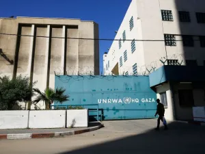 A Palestinian man walks past the building of the UNRWA headquarters in Gaza City on January 8, 2018. (MOHAMMED ABED/AFP/Getty Images) 