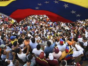 Venezuelan opposition leader and self-proclaimed interim president Juan Guaido (C, blue shirt) delivers a speech to supporters during a gathering in Socopo, Barinas State, Venezuela, on June 1, 2019. (AFP/ File Photo)