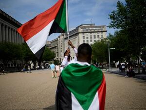 People protest against the deadly military raid on a nonviolent sit-in in Khartoum, Sudan, outside of the White House on June 8, 2019 in Washington, DC. (Brendan Smialowski / AFP)