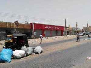 People walk in front of closed shops in the Sudanese capital Khartoum on June 10, 2019, the second day of a nationwide civil disobedience campaign called to pressure the ruling military into handing over power. (AFP/ File Photo)