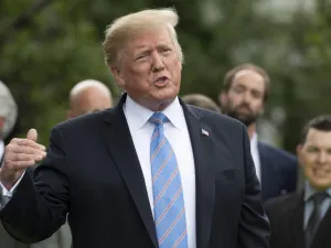 US President Donald Trump gives remarks after receiving a helmet from French race car driver and Indianapolis 500 winner Simon Pagenaud at the White House in Washington, DC, on June 10, 2019. (Jim WATSON / AFP)