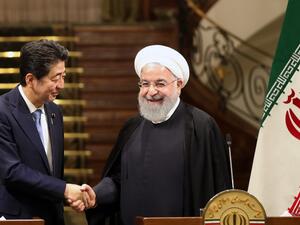 Iranian President Hassan Rouhani (R) shakes hands with Japanese Prime Minister Shinzo Abe, at the Saadabad Palace in the capital Tehran on June 12, 2019. (AFP/ File Photo)