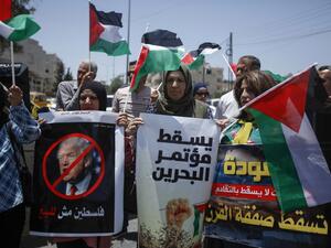 Palestinians hold banners and shout slogans as they rally against the US-led Israeli-Palestinian peace conference in Bahrain scheduled for next week, in Bethlehem in the occupied West Bank on June 20, 2019. (AFP/ File Photo)