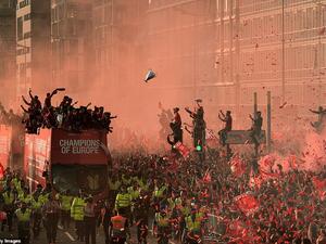 The celebrations are set to continue long into the night after a momentous day for the city with Champions League balloons floating in the red mist. (AFP/ File Photo)