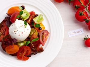 Emirates’ First and Business Class passengers travelling to and from Italy in August can look forward to an appetizer of the season’s heirloom tomatoes paired with burrata, an Italian cheese made from mozzarella and cream.