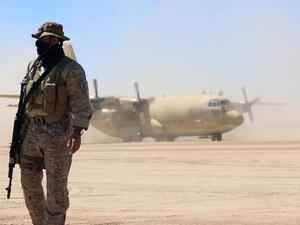 Saudi soldiers stand guard as a Saudi air force cargo plane, carrying aid, lands at an airfield in Yemen's central province of Marib, on February 8, 2018. (AFP/ File Photo)