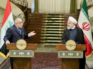 Iranian President Hassan Rouhani, right, and Iraqi Prime Minister Adel Abdul Mahdi speak at news conference in Iranian capital Tehran on Saturday ( AFP)